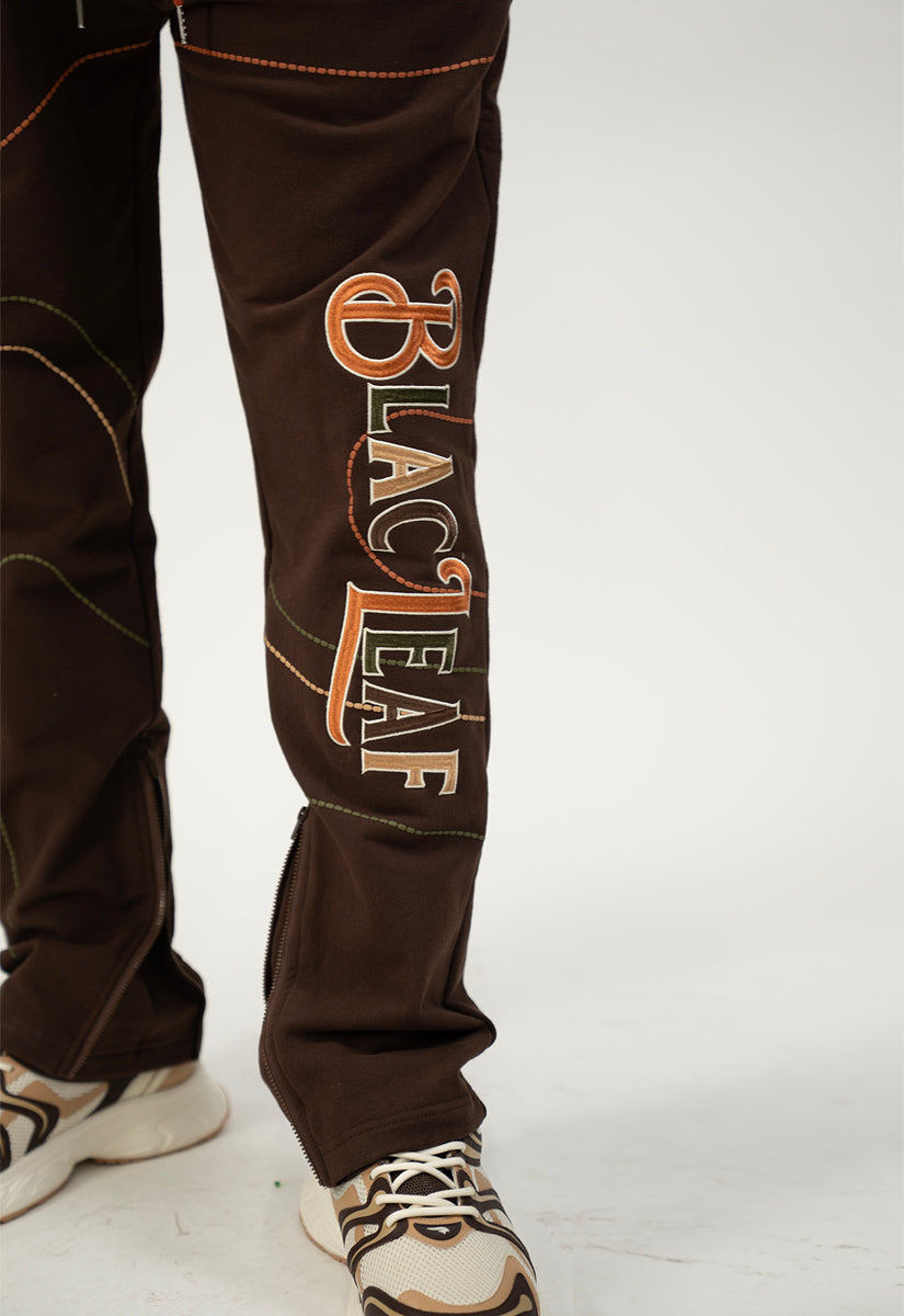 Brown sweat pants with 'Blac Leaf' logo on a white background