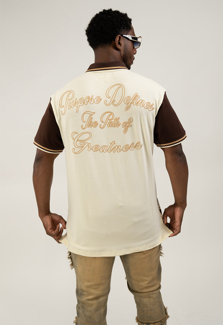 Man wearing a cream polo shirt with text design on back.