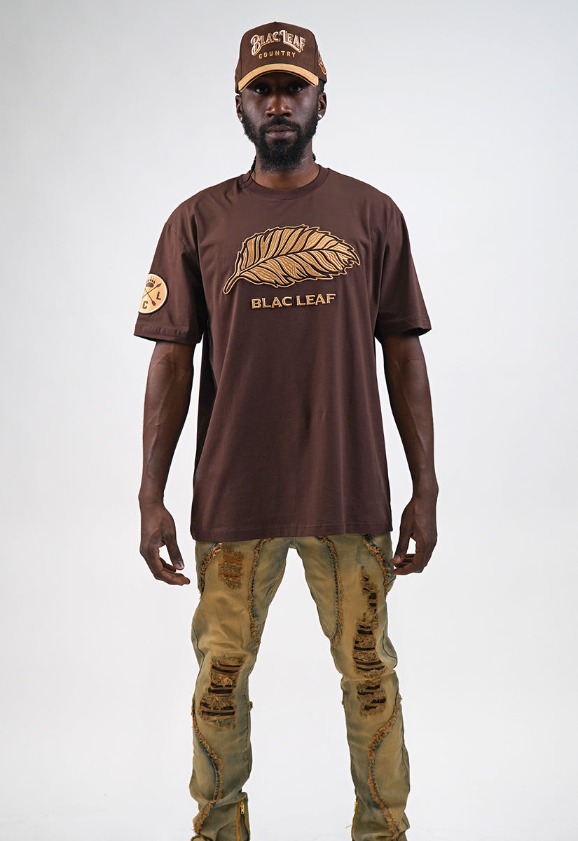 Timeless Embroidered Leaf Shirt, Denim Jeans, Trucker Hat and Sneakers Bundle